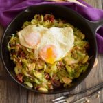 shredded brussels sprouts with eggs over easy