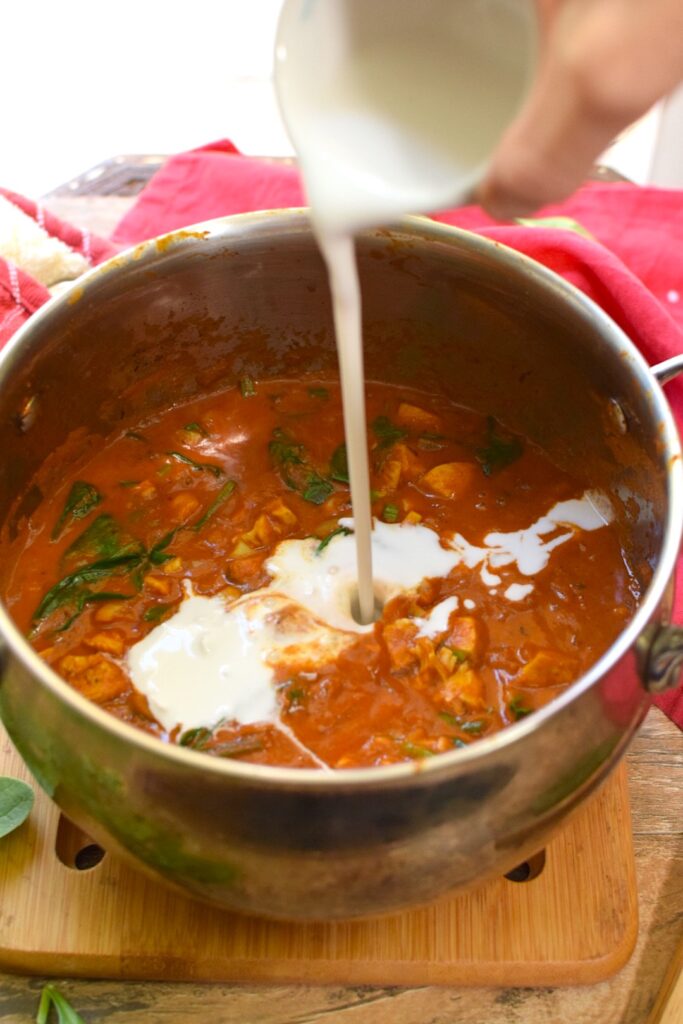 Pouring in coconut milk